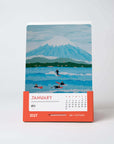 2027 art calendar featuring 12 colorful surf and ocean paintings by Alimo