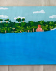 Fellow Traveler original painting by Alimo, figure wading toward a wave near the jungle