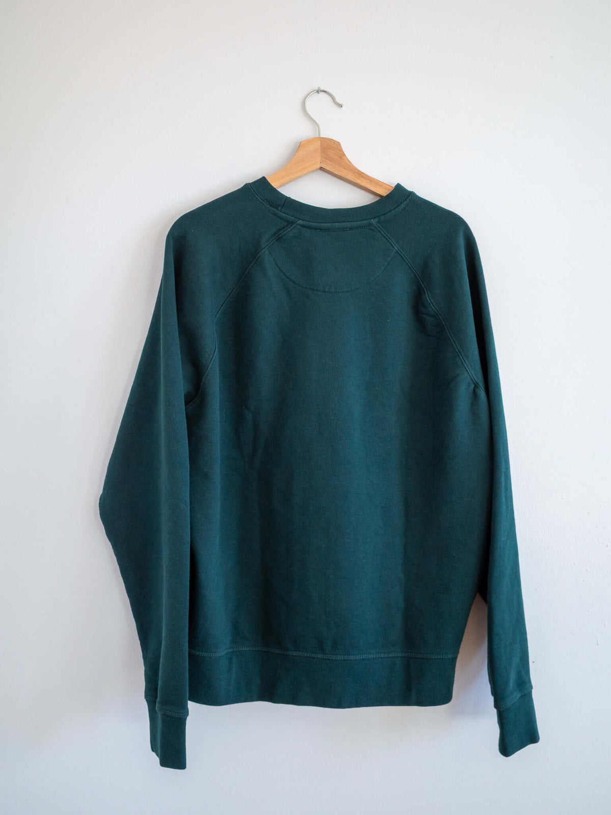 embroidered surfer on sweatshirt