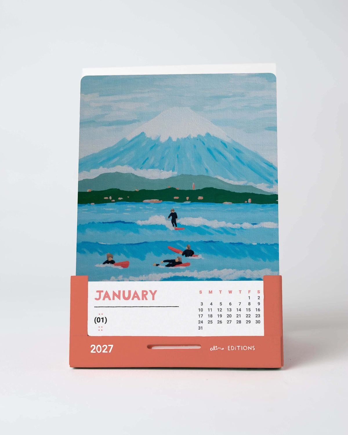 January card of the Alimo 2027 art desk calendar, an original painting of surfers below a snowy peak in Japan