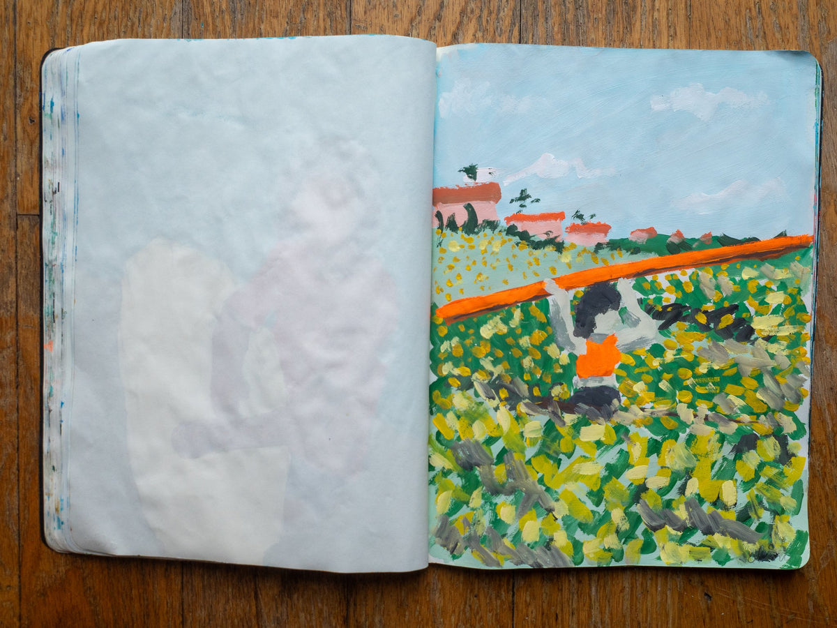 Drop 07 sketch 03 by Alimo in the open Moleskine sketchbook, painted on the right page only: a surfer carrying an orange board overhead through a flowering field