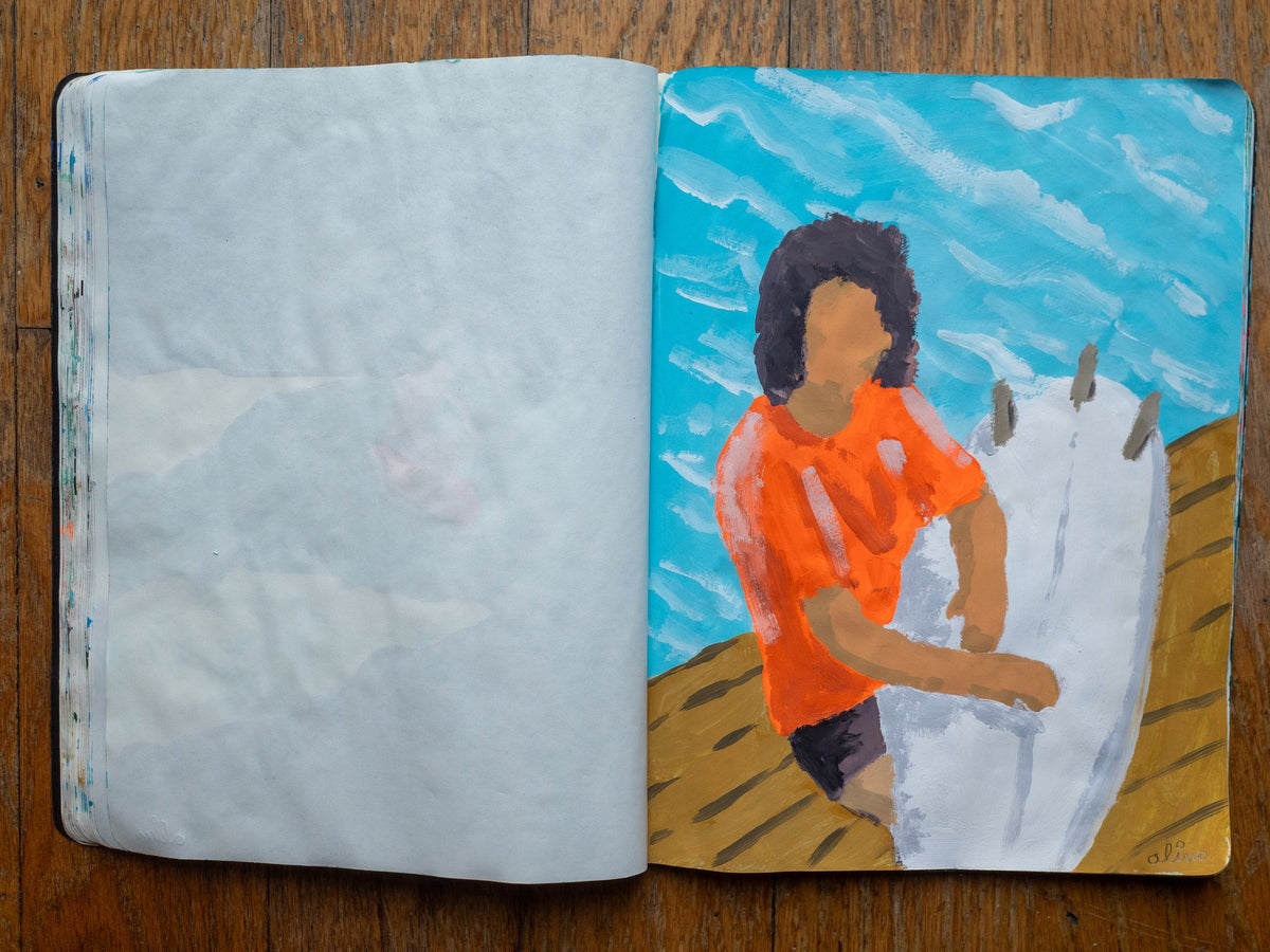 Drop 07 sketch 04 by Alimo in the open Moleskine sketchbook, painted on the right page only: a surfer in an orange shirt holding a white surfboard on a wooden deck