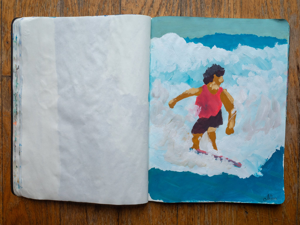 Drop 07 sketch 06 by Alimo in the open Moleskine sketchbook, painted on the right page only: a surfer in a pink top riding through white water